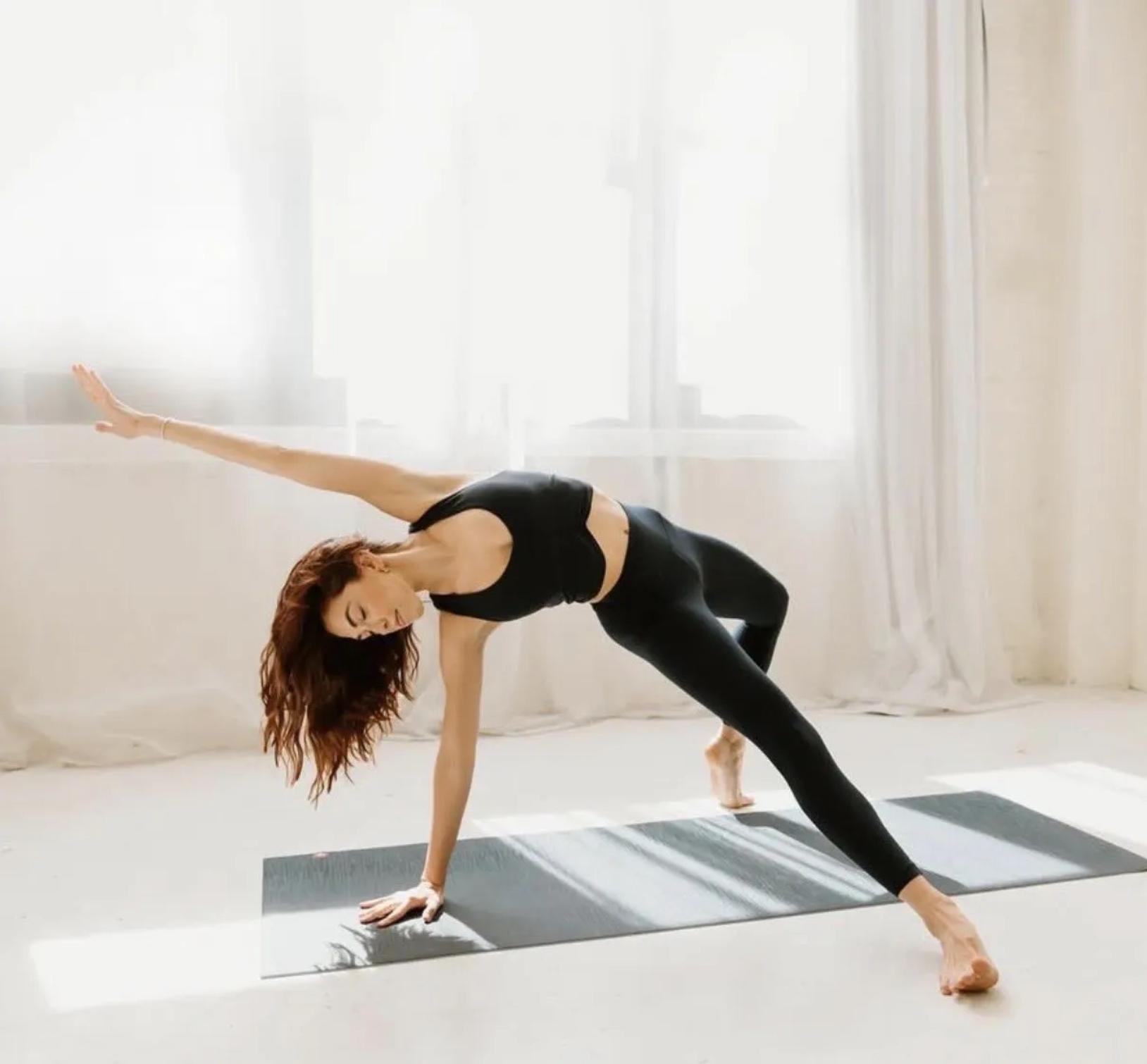 Person using the REC app on a yoga mat